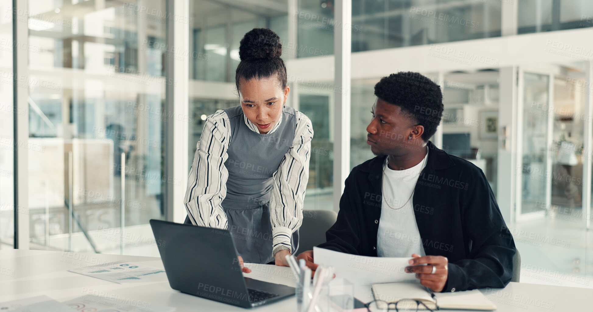 Buy stock photo Laptop, conversation and business people in office with documents for creative project in collaboration. Computer, paperwork and magazine editors with online article for publishing in workplace