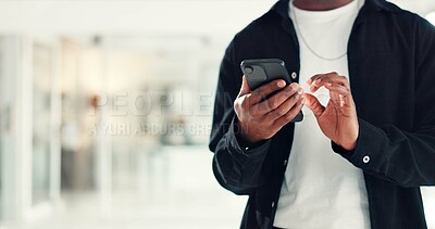Buy stock photo Hands, man and typing with phone in office for work email, check schedule or online communication. Business, space and employee with smartphone at agency for web search, app download and networking