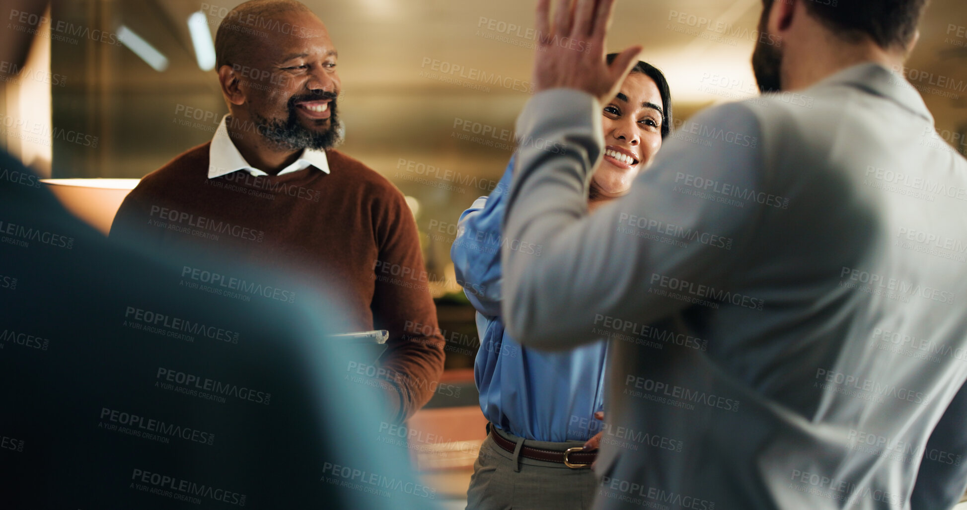 Buy stock photo High five, meeting and smile with business people in office at night for feedback success. Tablet, celebration and congratulations with employee team for work goals, collaboration or partnership
