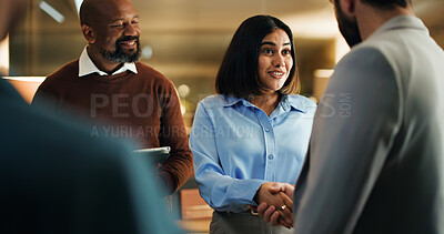 Buy stock photo Handshake, meeting and smile with business people in office at night for feedback success. Tablet, shaking hands and welcome with employee team for work goals, collaboration or partnership strategy