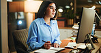 Writing, notes and businesswoman in office at night with research for finance report with deadline. Computer, reading and female financial manager with investment proposal for overtime in workplace.