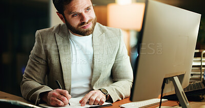 Buy stock photo Writing, night and man in office with desktop, idea or word planning for screenplay. Concentration, research and screenwriter in workplace with tech, note taking or brainstorming in overtime work.