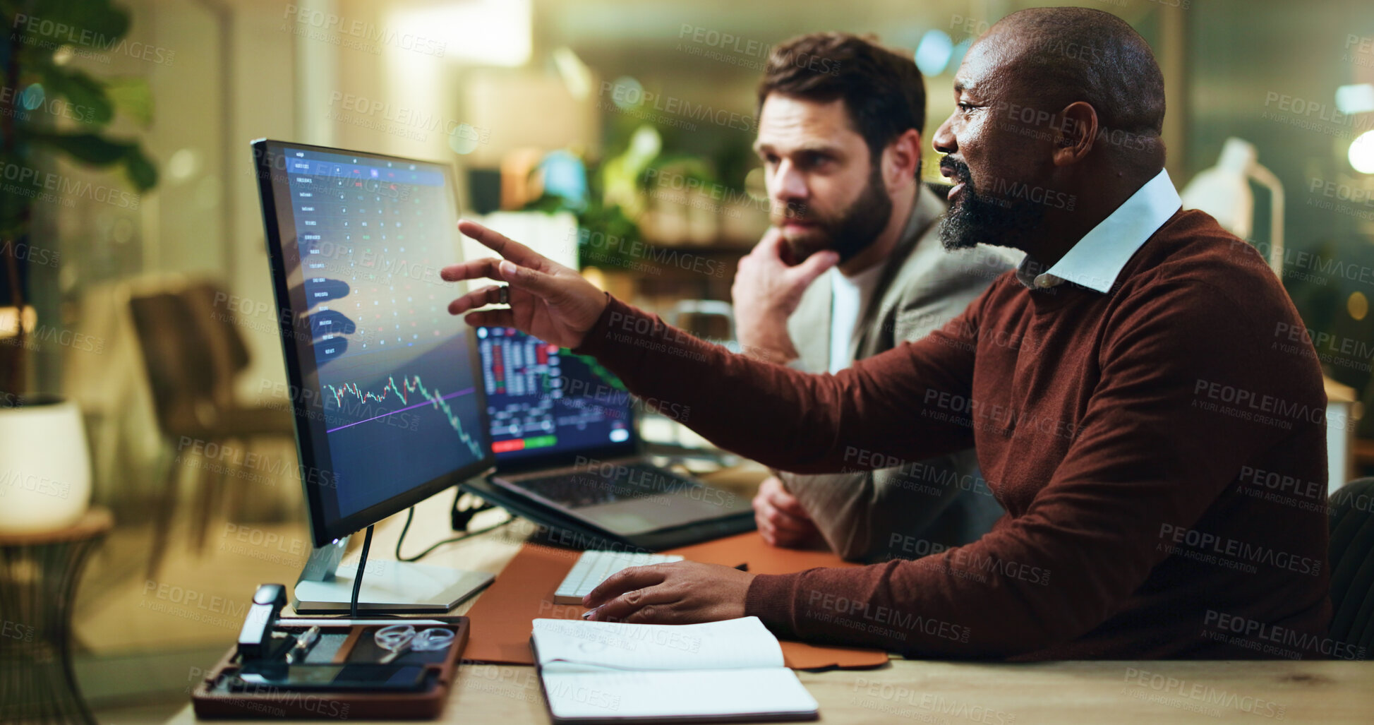 Buy stock photo Pointing, trading and computer screen with business people in office for stock market, night and graph. Broker, partnership and investment chart with employees for account growth and overtime