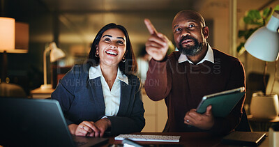 Buy stock photo Night, pointing and business people on tablet in office for planning, investment decision and meeting. Corporate, dark and man with woman on tech for finance review, collaboration and discussion