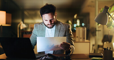 Buy stock photo Laptop, research and documents with business man in office for night, account graph and reading. Budget report, audit deadline and paperwork with person in agency for review, chart and overtime