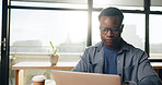 Coffee shop, freelance and black man on laptop for working on online report, article and research. Creative, remote worker and person on computer for copywriting, editing news and website in cafe