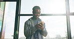 Scroll, happy and man in office with phone, social media post and text message notification. Reading, smile or black person in workplace with tech, online search or business communication on internet
