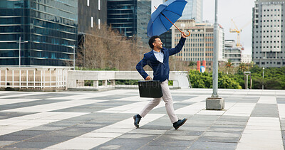 Buy stock photo City, running and umbrella with business man outdoor for commute, property or real estate insurance. Briefcase, dance and weather with happy developer downtown for architecture or building cover
