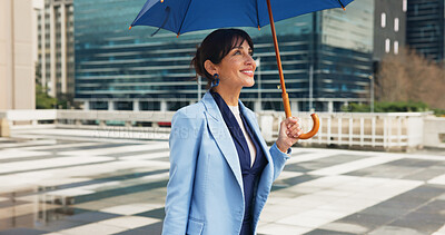 Buy stock photo Walking, umbrella and business woman in city for travel, morning commute and trip to work. Professional, inspiration and person with rain protection and confident for career, job and ambition in town