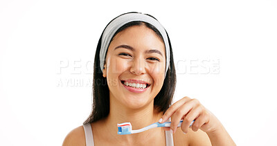 Buy stock photo Dental portrait, girl and toothbrush in studio for oral hygiene, mouth cleaning or fresh breath. Mockup space, person or happy with toothpaste on white background for brushing teeth or plaque removal