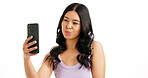 Woman, selfie and kiss in studio for hair care, salon review or social media platform. Girl, smile or photography on white background with hairstyle, beauty blog update or pout with happiness