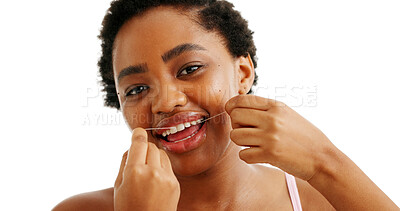 Buy stock photo Flossing, dental care and black woman with a smile in studio for oral hygiene, wellness and plaque. Cleaning, portrait and female person with healthy teeth, grooming and happy on white background