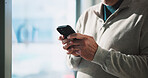 Typing, hands and man in office with phone, email feedback or communication in finance company. Text, business and person in workplace with technology, document download or checking meeting schedule.
