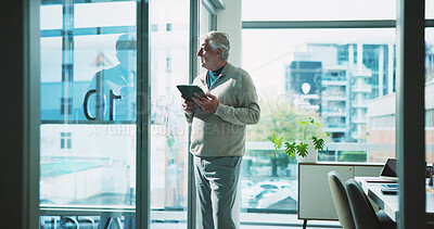 Buy stock photo Mature man, window and thinking in office with tablet, idea or plan for online campaign. Serious, business person and digital marketing manager in company with tech, reflection and research for ROI.