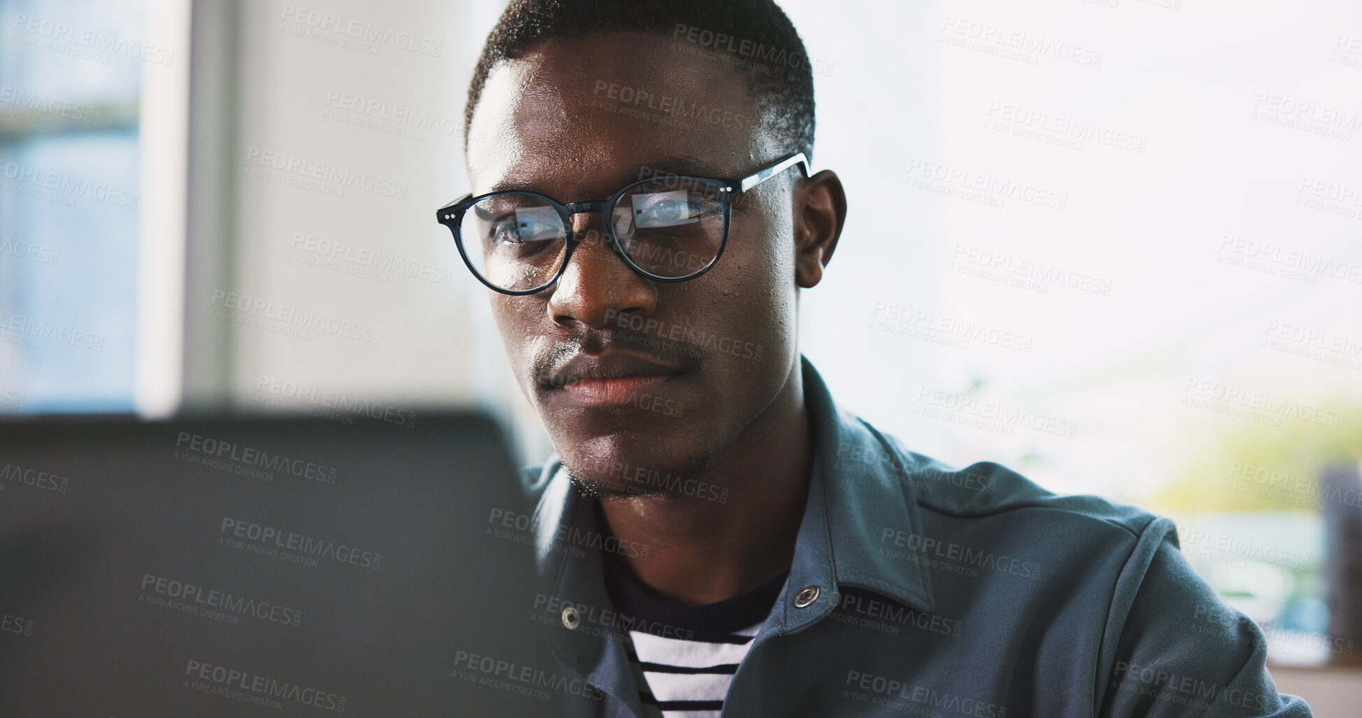 Buy stock photo Laptop, glasses and reading with business black man in office for news article, source fact check and story. Publishing, review and research with person in media agency for online report and editor