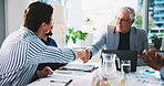 Business, meeting and men with handshake in office for finance merger, partnership deal or offer. Tech, documents and investors shaking hands in boardroom for investment success, welcome or agreement