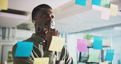 Buy stock photo Thinking, brainstorming and man in office with sticky notes, ideas or solution for project management. Planning, vision or black person in workplace with problem solving, business insight or strategy