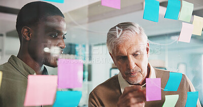Buy stock photo Mature man, glass wall and sticky note with team, coach and brainstorming for project at media company. Business people, board and employee with review, planning or collaboration at creative agency