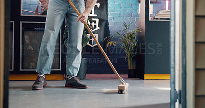 Buy stock photo Broom, legs and small business with man in tattoo parlor for preparation or start of work. Cleaning, feet and sweeping floor with person in startup studio for chores, responsibility or tasks