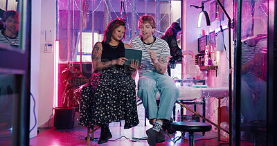 Buy stock photo Tablet, tattoo artist and planning with client in studio for artwork design preview, aesthetic and body art. Permanent ink decision, customer and creative process with people for digital sketch