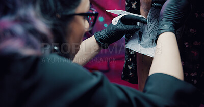 Buy stock photo Tattoo, stencil and hands with artist in store for body art design, studio and culture. Permanent ink aesthetic, customer and artwork with people and tracing for creative, process or identity