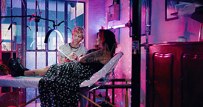 Buy stock photo Tablet, tattoo artist and sketch with client in studio for artwork design preview, aesthetic or body art culture. Permanent ink decision, customer and creative process with people for digital drawing