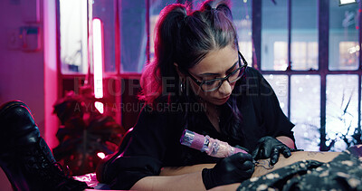 Buy stock photo Tattoo, artist and leg with woman in store for permanent ink, linework design or aesthetic. Culture, self expression and tattooing parlor with person and customer in studio for identity and body art