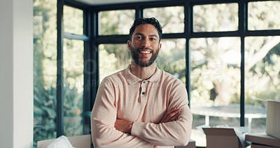 Buy stock photo Portrait, smile and man in new home with arms crossed for moving, real estate property or ownership. Landlord, confidence and dream house for relocation, mortgage and homeowner with investment in UAE