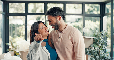 Buy stock photo Keys, smile and moving with couple in new home for property investment, love and partner. Hug, real estate growth and homeowner purchase with man and woman in house for relocation, happy and rent