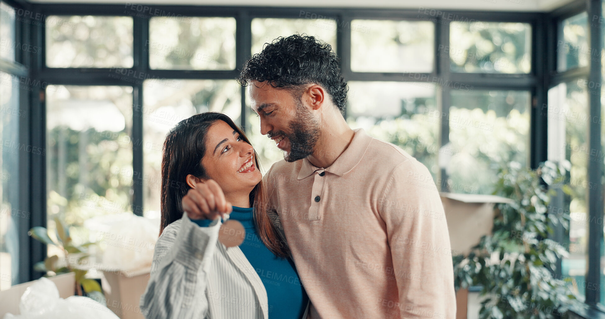 Buy stock photo Keys, smile and moving with couple in new home for property investment, love and partner. Hug, real estate growth and homeowner purchase with man and woman in house for relocation, happy and rent