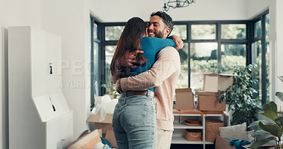 Buy stock photo Happy couple, hug and relocation at new home with boxes, excited and fresh start with property investment. People, man and woman with embrace, care and love with moving, celebration and real estate