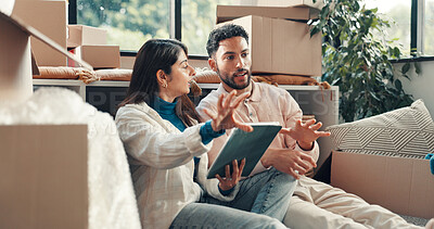Buy stock photo Conversation, tablet and boxes with couple in new home for property or real estate investment. App, moving house and planning with people in apartment for development, mortgage or relocation
