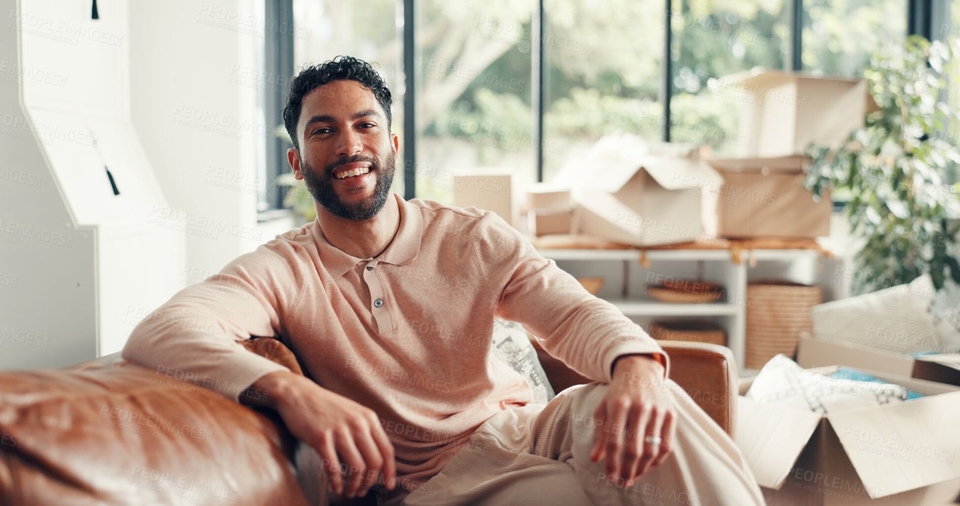 Buy stock photo Portrait, sofa and happy man in new home for moving in, real estate investment or property ownership. Landlord, smile and person in dream house for relocation, mortgage and homeowner in living room