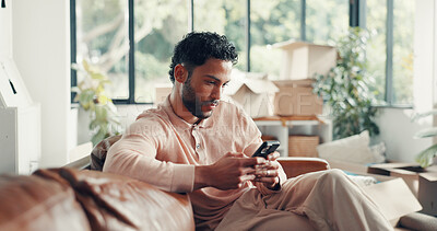 Buy stock photo Moving, boxes and man with smartphone, new home or browsing renovation ideas on social media or web. Scroll, online and person with tech for remodeling, relax or research for interior design in house