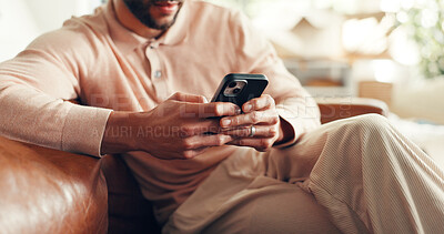 Buy stock photo Hands, man and relax with phone on sofa for text message, dating site or browsing social media. Smartphone, person and download app in home for streaming service, online communication and connection