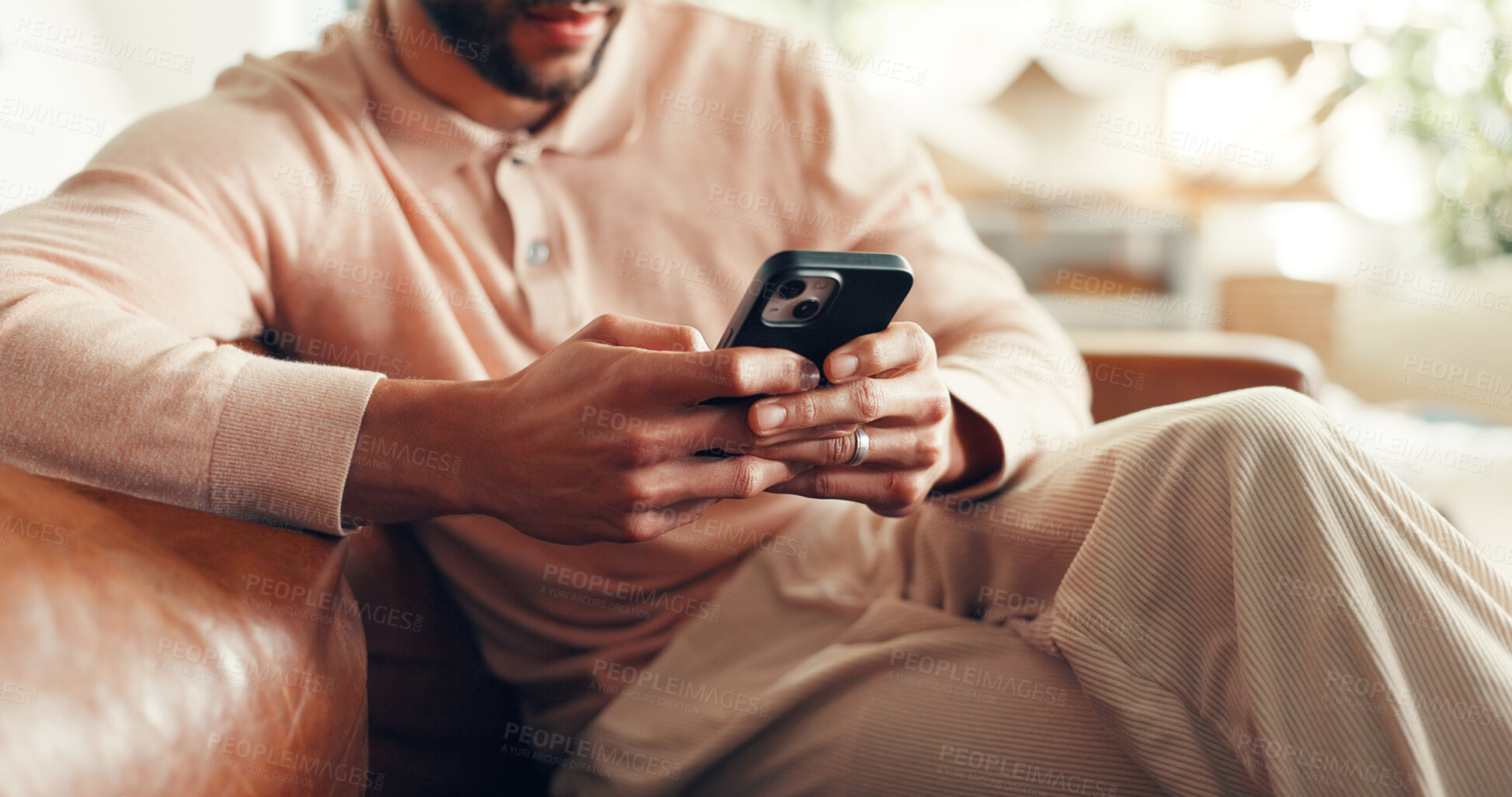 Buy stock photo Hands, man and relax with phone on sofa for text message, dating site or browsing social media. Smartphone, person and download app in home for streaming service, online communication and connection