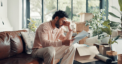 Buy stock photo Moving in, man and stress with documents in new home for title deed error, compliance issue or worry. Homeowner, person or headache with paperwork for hidden insurance clause, mortgage debt or crisis