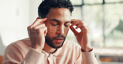 Buy stock photo Home, headache and man in lounge, pain and stress with brain fog, worry and tension. Apartment, exhausted and person with migraine, fatigue or tired with pressure, temple massage or sick with burnout
