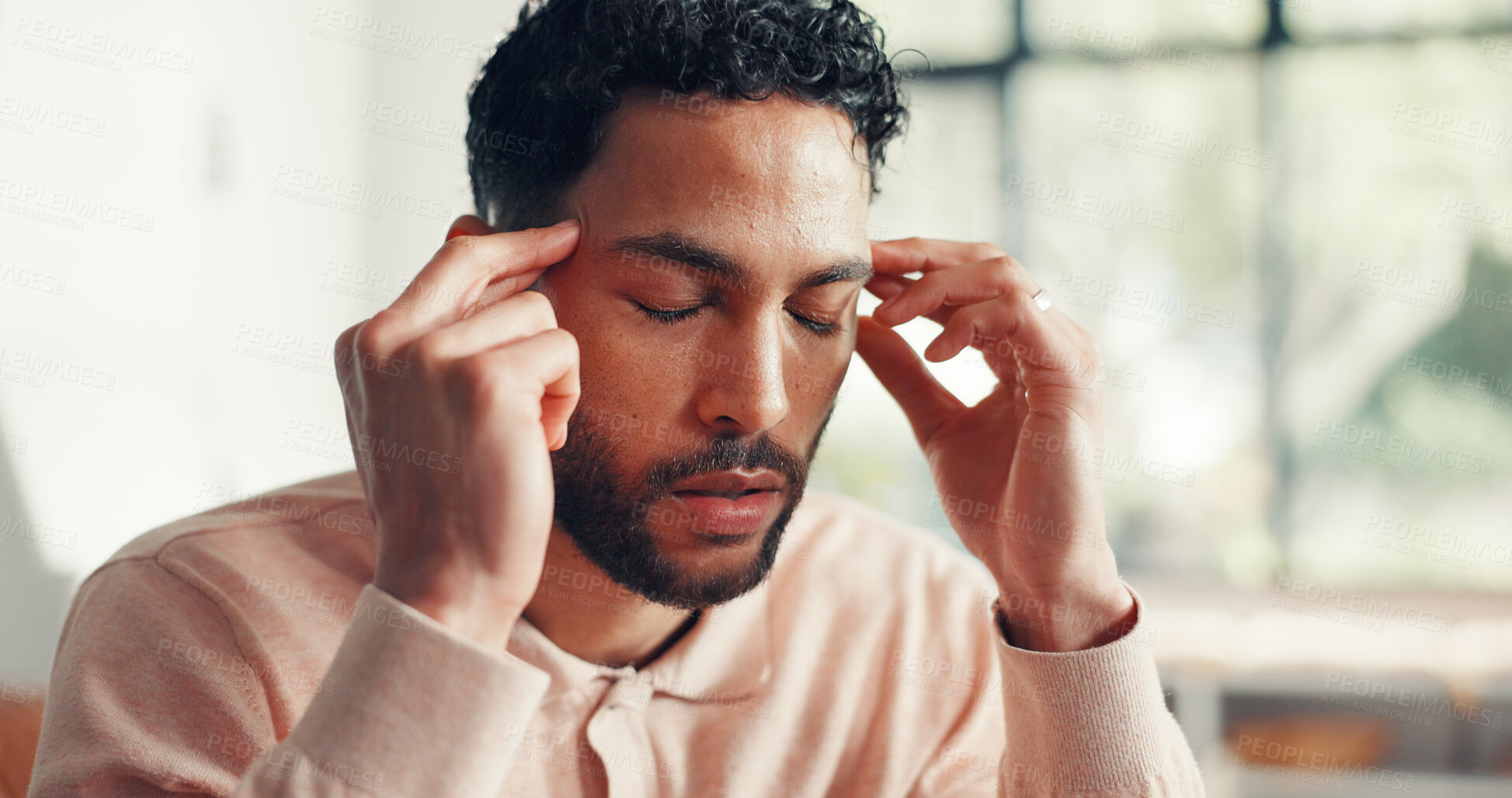 Buy stock photo Home, headache and man in lounge, pain and stress with brain fog, worry and tension. Apartment, exhausted and person with migraine, fatigue or tired with pressure, temple massage or sick with burnout