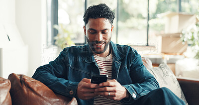 Buy stock photo Happy, texting and man in home with phone, doom scrolling and funny chat on app. Social media, meme and Asian male in living room with mobile, virtual game or online communication in message update.