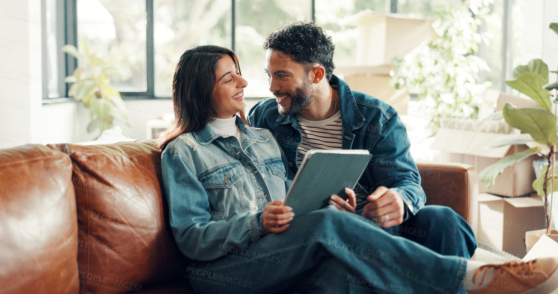Buy stock photo Happy couple, tablet and talk on sofa at new house with laugh, excited and online shopping for furniture. Man, woman and tech with interior design app, boxes and real estate investment at property