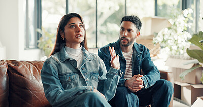 Buy stock photo Couple, living room and argument with moving, anxiety and drama in home or apartment. Annoyed, woman and man with dispute, angry and fight with relocation and stress or crisis with toxic partner