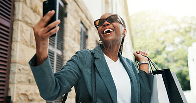 Buy stock photo Happy, black woman or selfie with shopping bag in city for photography, picture or memory. Female person, African shopper or smile with sunglasses or gifts for capture moment or post in an urban town