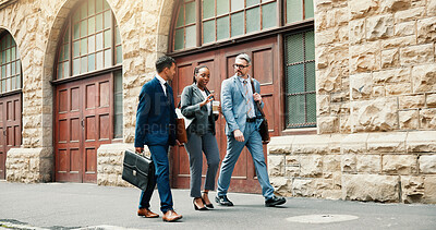 Buy stock photo Walking, group and employees in city, talking and plan for criminal case, collaboration and outdoor. Lawyers, men and woman with coffee on street, conversation and travel to court for legal trial