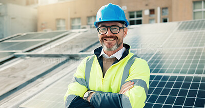 Buy stock photo Solar panel, happy man and portrait of engineer with arms crossed on roof in city. Photovoltaic electrician, confident and mature technician with renewable power, sustainable and clean energy outdoor