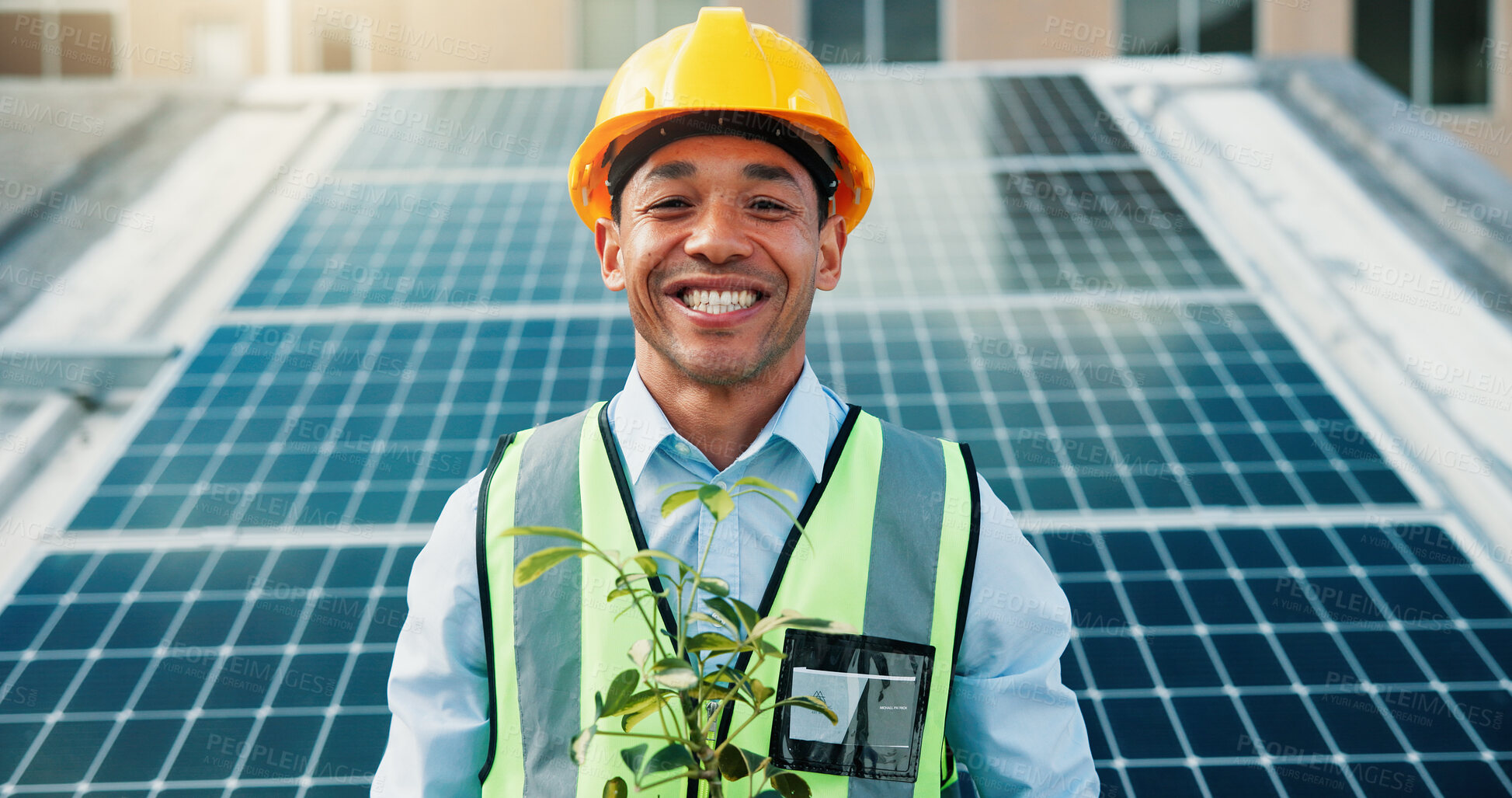 Buy stock photo Solar panel, happy man and portrait of engineer with plant on roof in city for clean energy. Photovoltaic electricity, smile and technician with renewable power, environment and eco friendly leaves