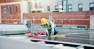 Buy stock photo Solar panel, man and maintenance engineer on roof in city for installation, repair and inspection. Photovoltaic electricity, technician and fix system for renewable power, sustainable or clean energy