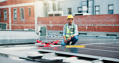 Buy stock photo Industry, solar panels and worker on rooftop outdoor for PV installation, repairs or maintenance. City, photovoltaic cells and male technician for renewable energy project with site inspection.