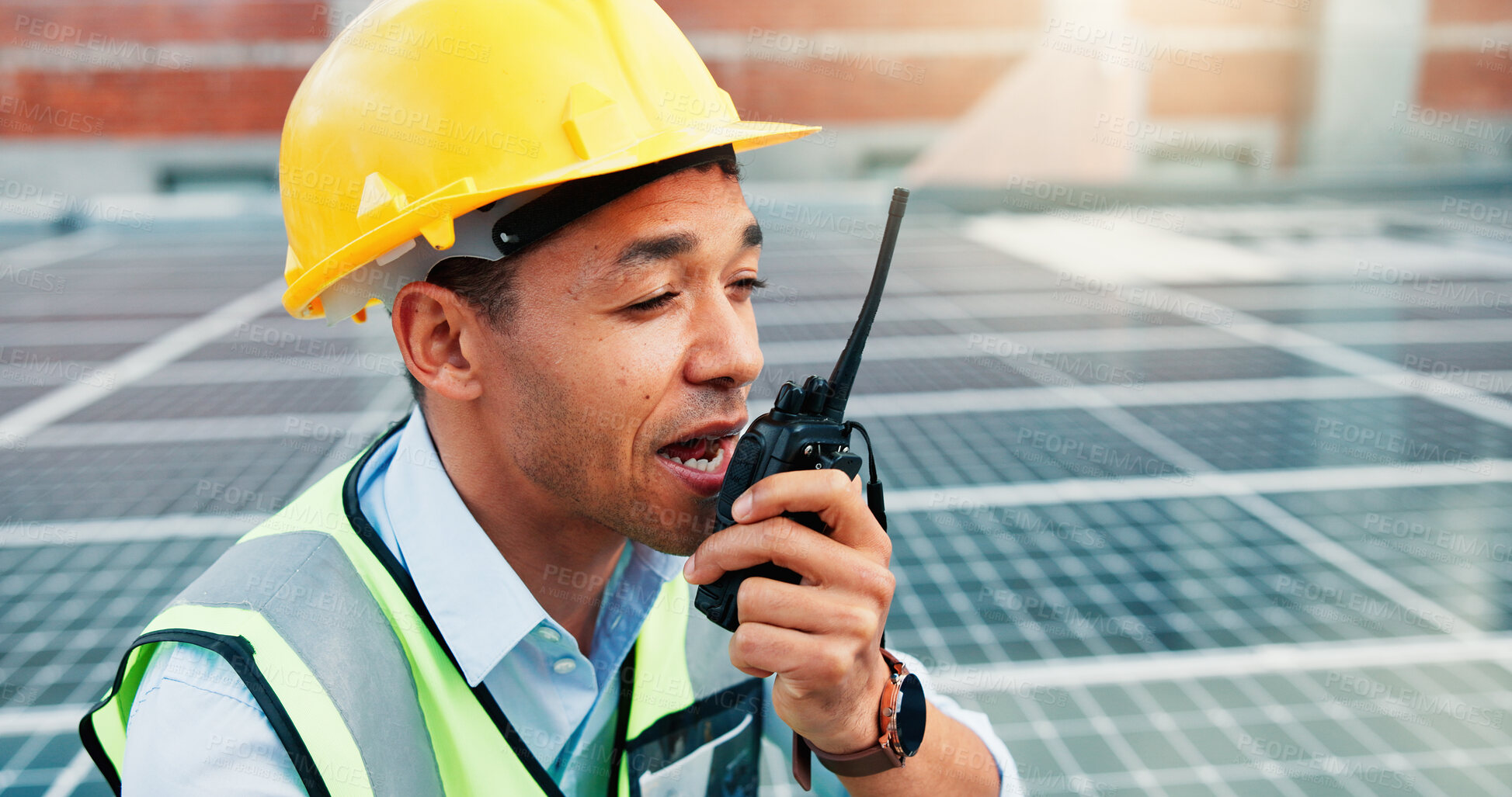 Buy stock photo Man, solar panel worker and radio on rooftop for PV installation, troubleshoot or inspection. Tech, photovoltaic technician and repair feedback on site for renewable energy or grid system maintenance