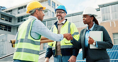 Buy stock photo Solar panel, technician or handshake with partnership outdoor for PV installation, welcome or team. Photovoltaic blueprint, people or shaking hands with tech on rooftop for site assessment or project